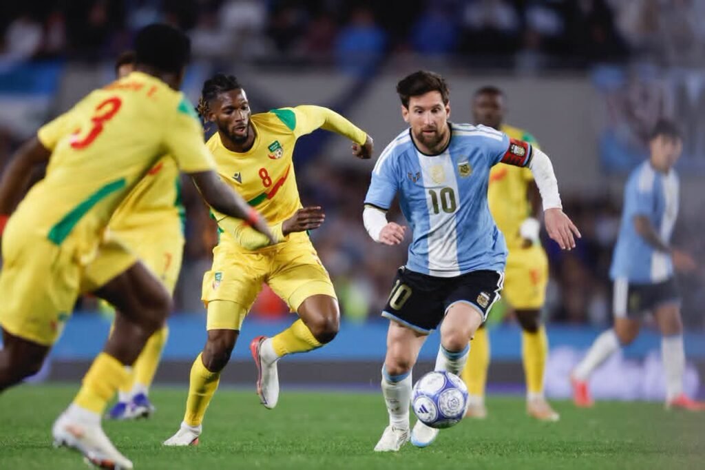 Lionel Messi (R) of Argentina vies for the ball with Imourane Hassan (L) of Benin during an international friendly match between Argentina and Benin at the Estadio Monumental in Buenos Aires, Argentina, 06 October 2026. The match marks the final international appearance for Messi, ending his 21-year career with the Argentina national team. EPA / Juan Ignacio Roncoroni